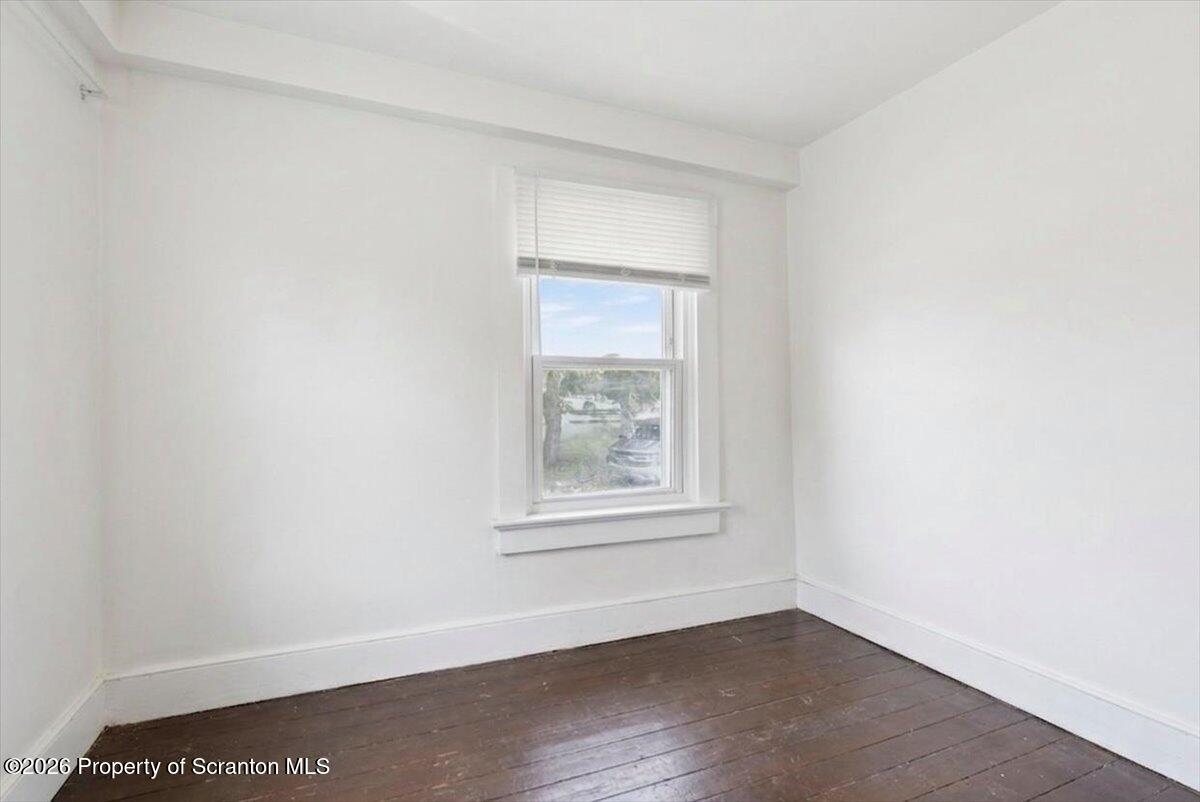 22 Quay Avenue Mount Pocono, PA 18344 - Photo 40 of 62 an empty room with wooden floor and windows