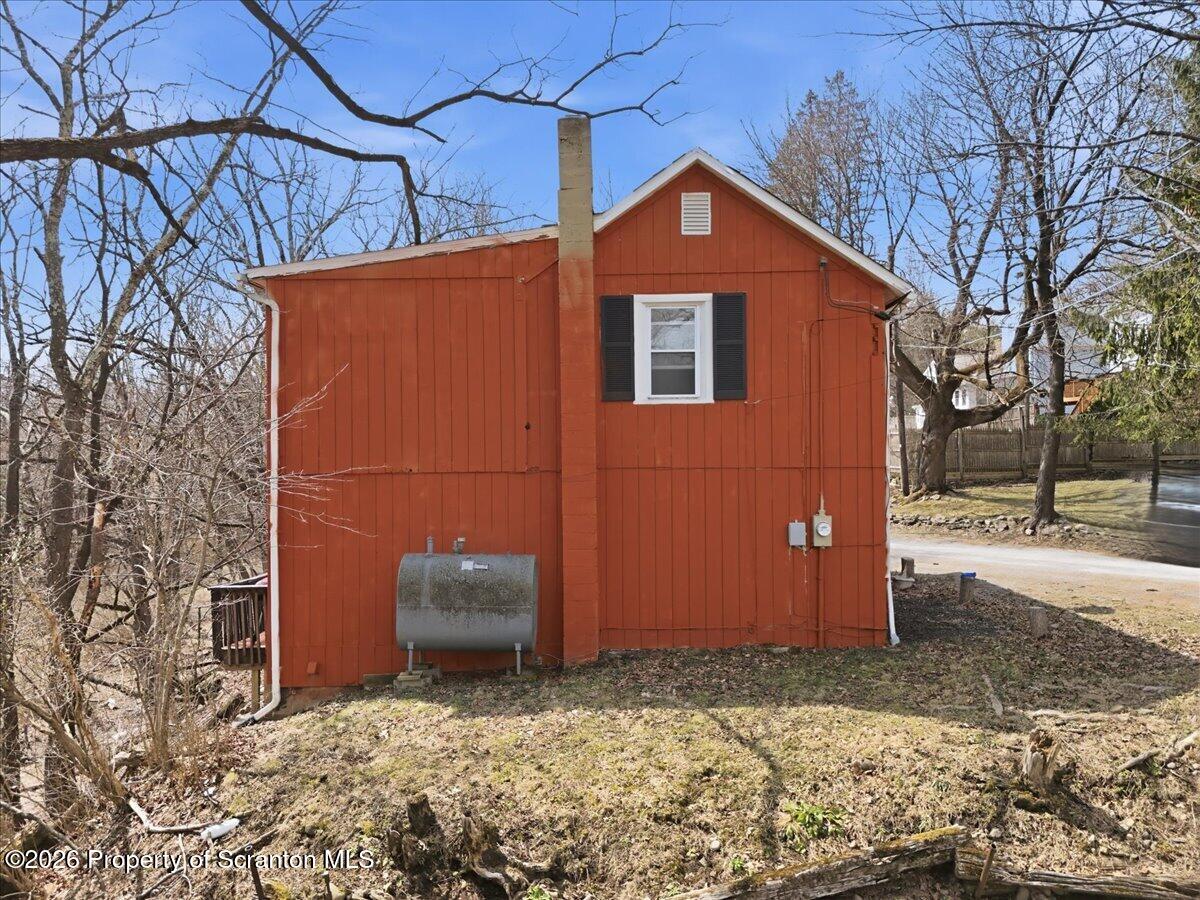22 Quay Avenue Mount Pocono, PA 18344 - Photo 51 of 62 a backyard of a house with sofas fire pit and wooden fence