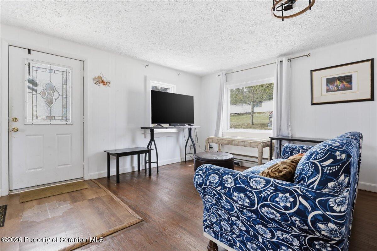 22 Quay Avenue Mount Pocono, PA 18344 - Photo 9 of 62 a living room with furniture a flat screen tv and a window