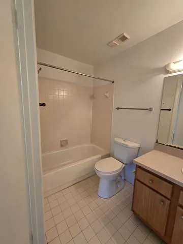 a bathroom with a toilet a sink and a bathtub