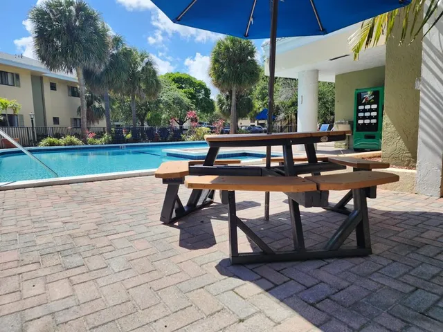 a view of a backyard with sitting area
