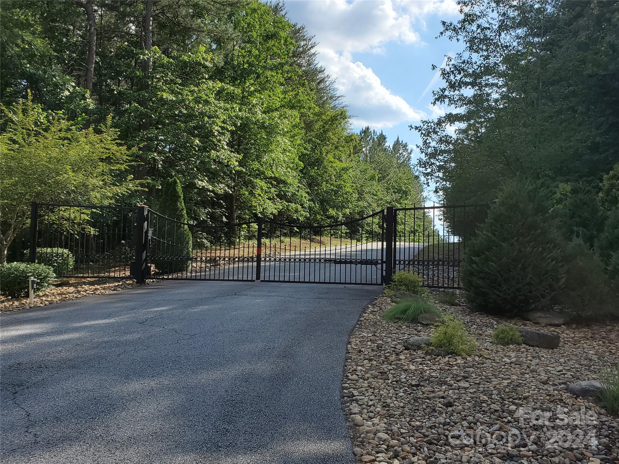 0 Sunset Drive, Unit 12 Mill Spring, NC 28756 - Photo 20 of 21 a view of a street with a bench and trees