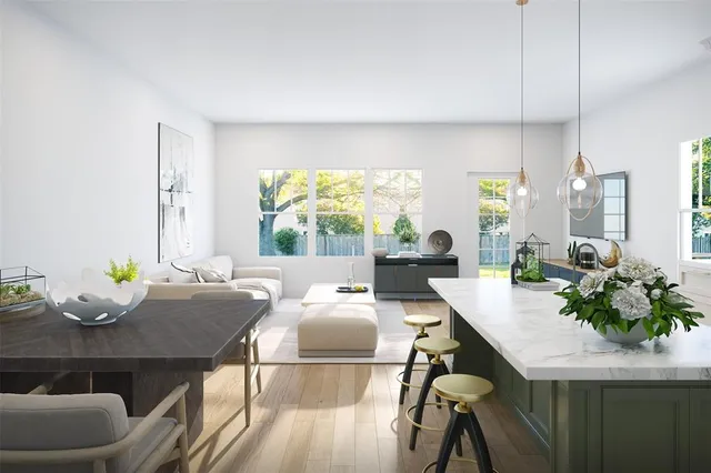 a living room with furniture potted plant floor to ceiling windows and a flat screen tv