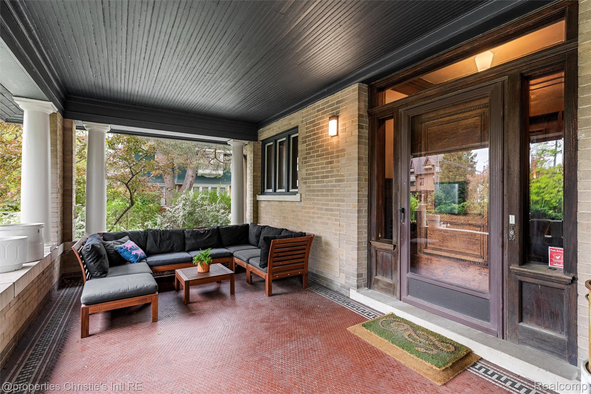 36 Longfellow Street Detroit, MI 48202 - Photo 4 of 81 Sunroom / solarium featuring healthy amount of natural light and brick wall