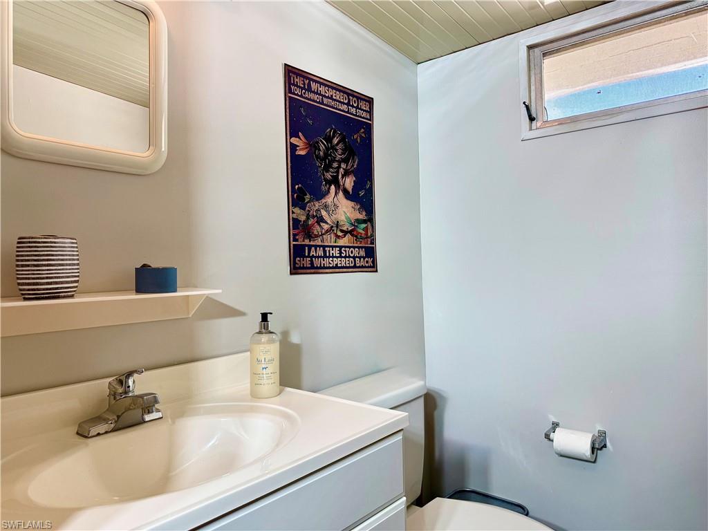 16 Bass Lane, Unit 16 Naples, FL 34114 - Photo 12 of 45 a bathroom with a sink and a toilet
