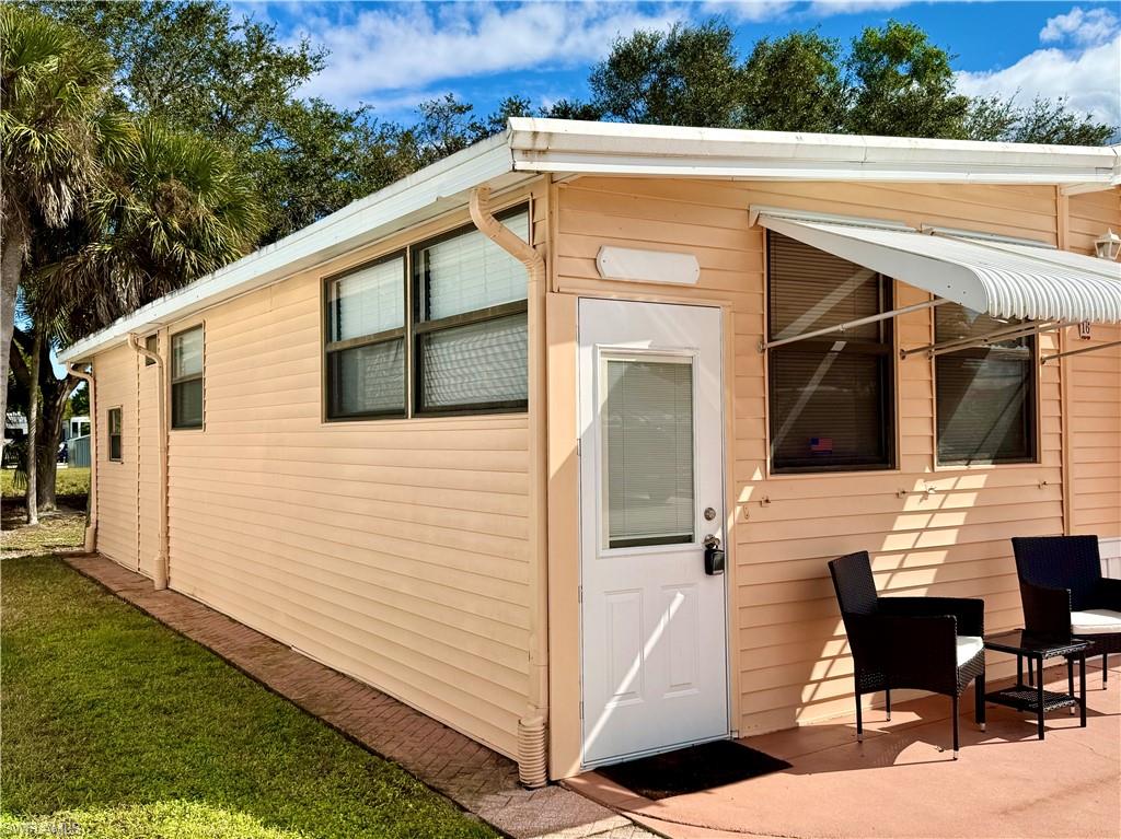 16 Bass Lane, Unit 16 Naples, FL 34114 - Photo 2 of 45 a view of house with backyard