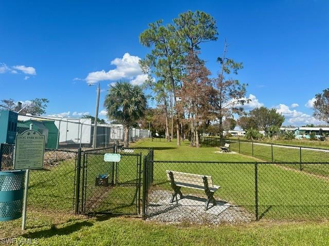 16 Bass Lane, Unit 16 Naples, FL 34114 - Photo 36 of 46 a park with a bench and trees