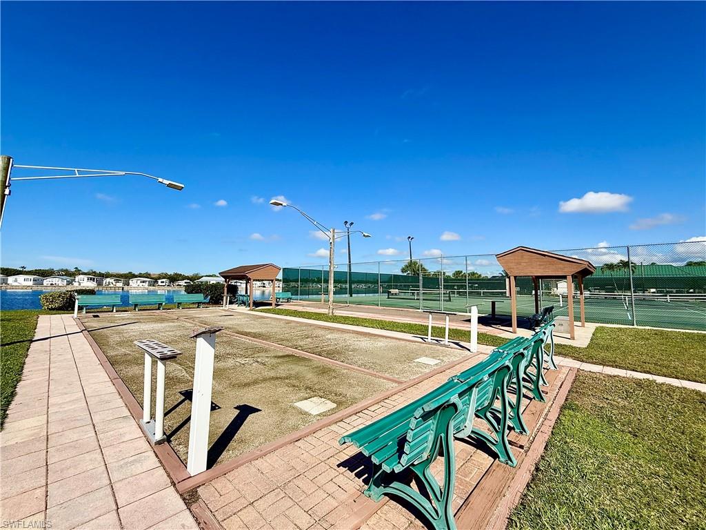 16 Bass Lane, Unit 16 Naples, FL 34114 - Photo 40 of 45 a view of a patio with swimming pool