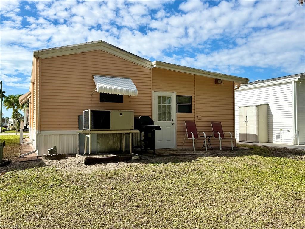 16 Bass Lane, Unit 16 Naples, FL 34114 - Photo 4 of 45 a front view of a house with garden