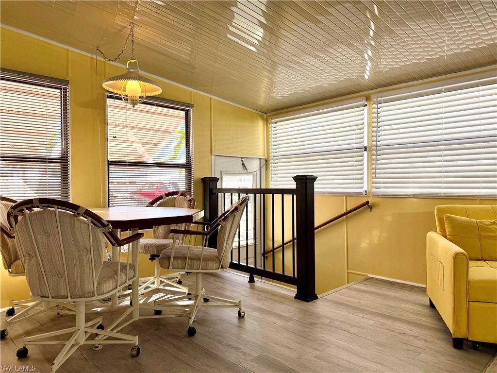 16 Bass Lane, Unit 16 Naples, FL 34114 - Photo 6 of 45 a view of gym equipment with wooden floor