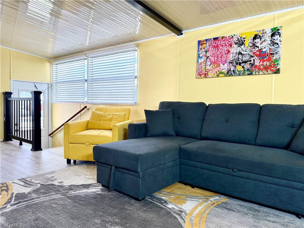 16 Bass Lane, Unit 16 Naples, FL 34114 - Photo 7 of 45 a living room with furniture and a couch