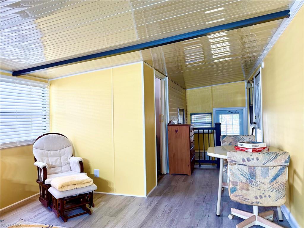 16 Bass Lane, Unit 16 Naples, FL 34114 - Photo 10 of 45 a room with furniture and a window