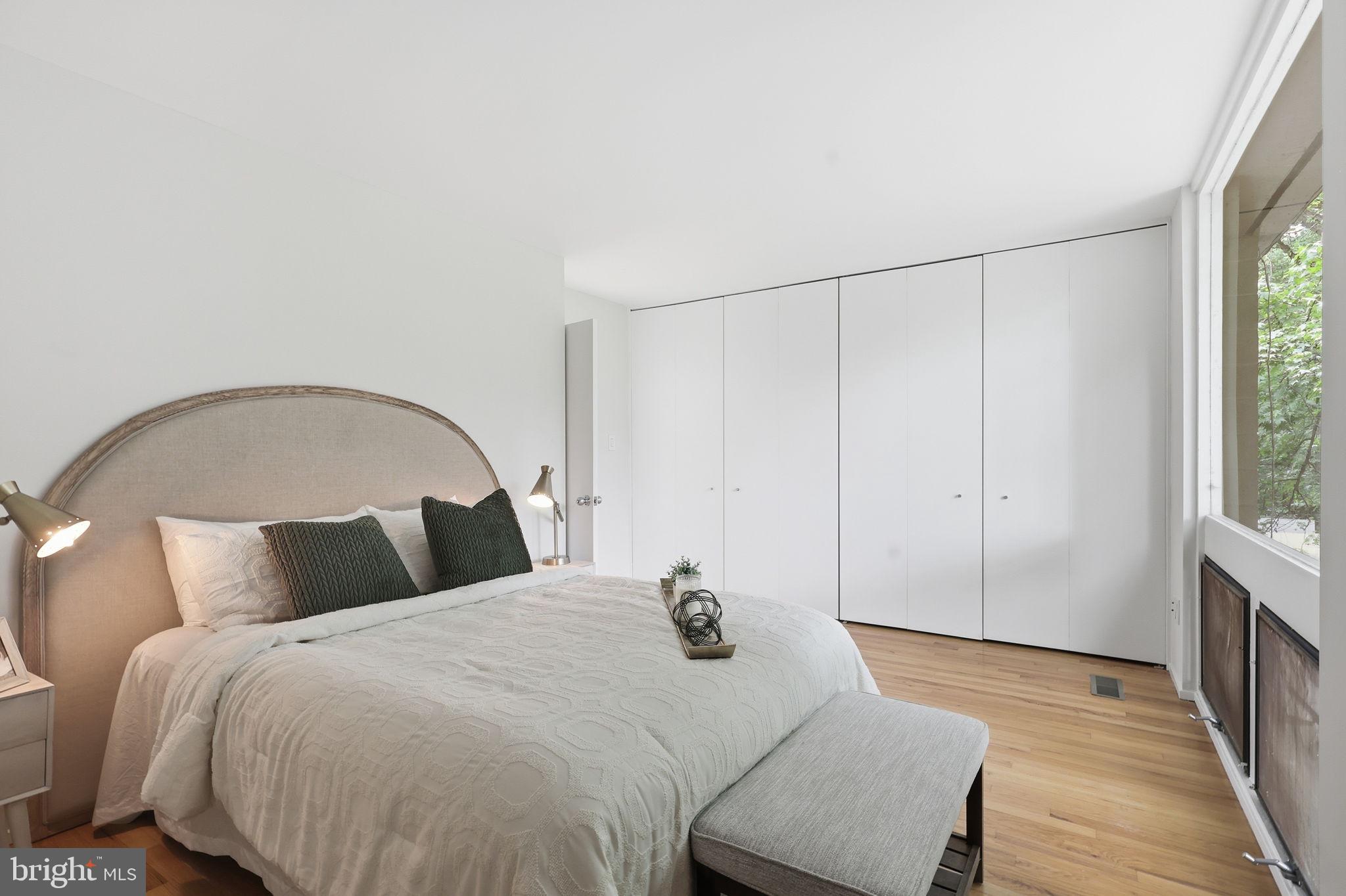 11510 Maple Ridge Road Reston, VA 20190 - Photo 20 of 43 a bedroom with a bed and a window