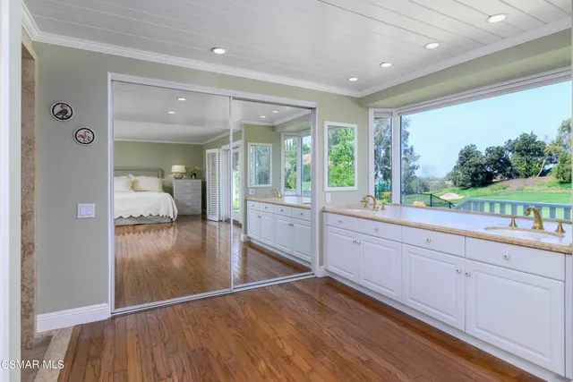 a bathroom with a sink and a large mirror