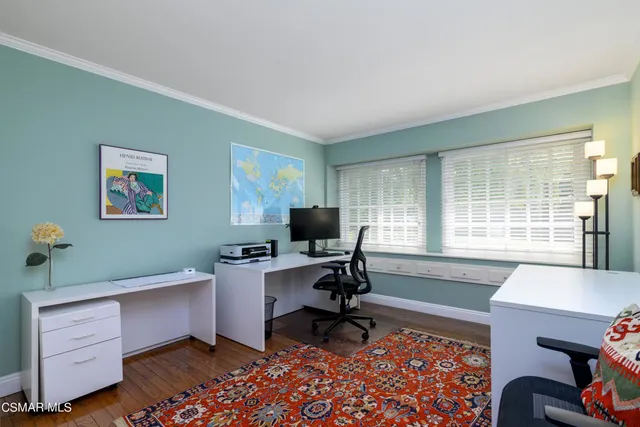 a workspace with furniture and window