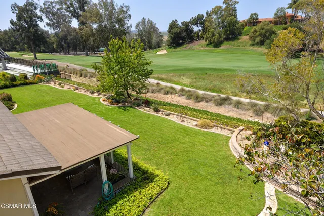 a view of a golf course with a lake view