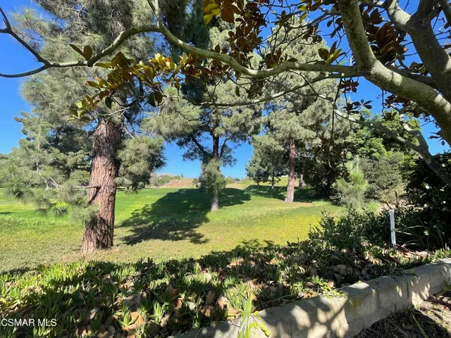 a view of a backyard with sitting area