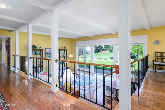 a view of a porch with wooden floor