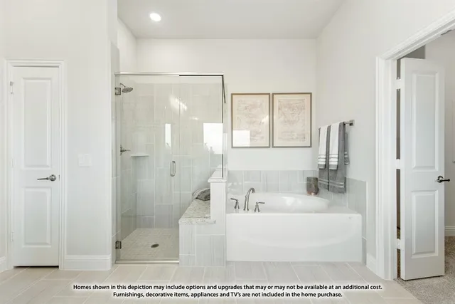 a white bath tub sitting next to a bathroom