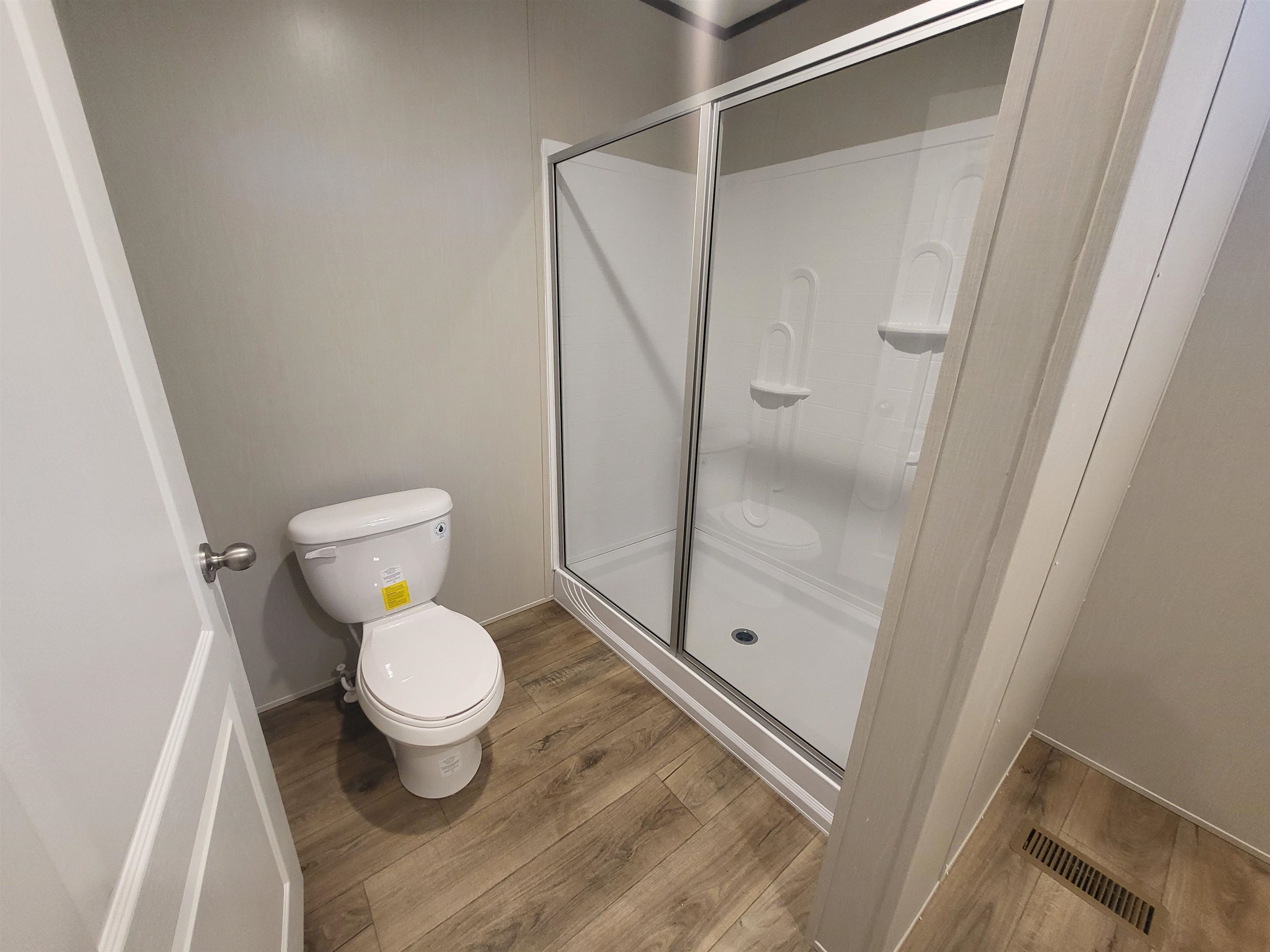 148 Holly Berry Way Fruita, CO 81521 - Photo 14 of 19 a bathroom with a toilet and a shower