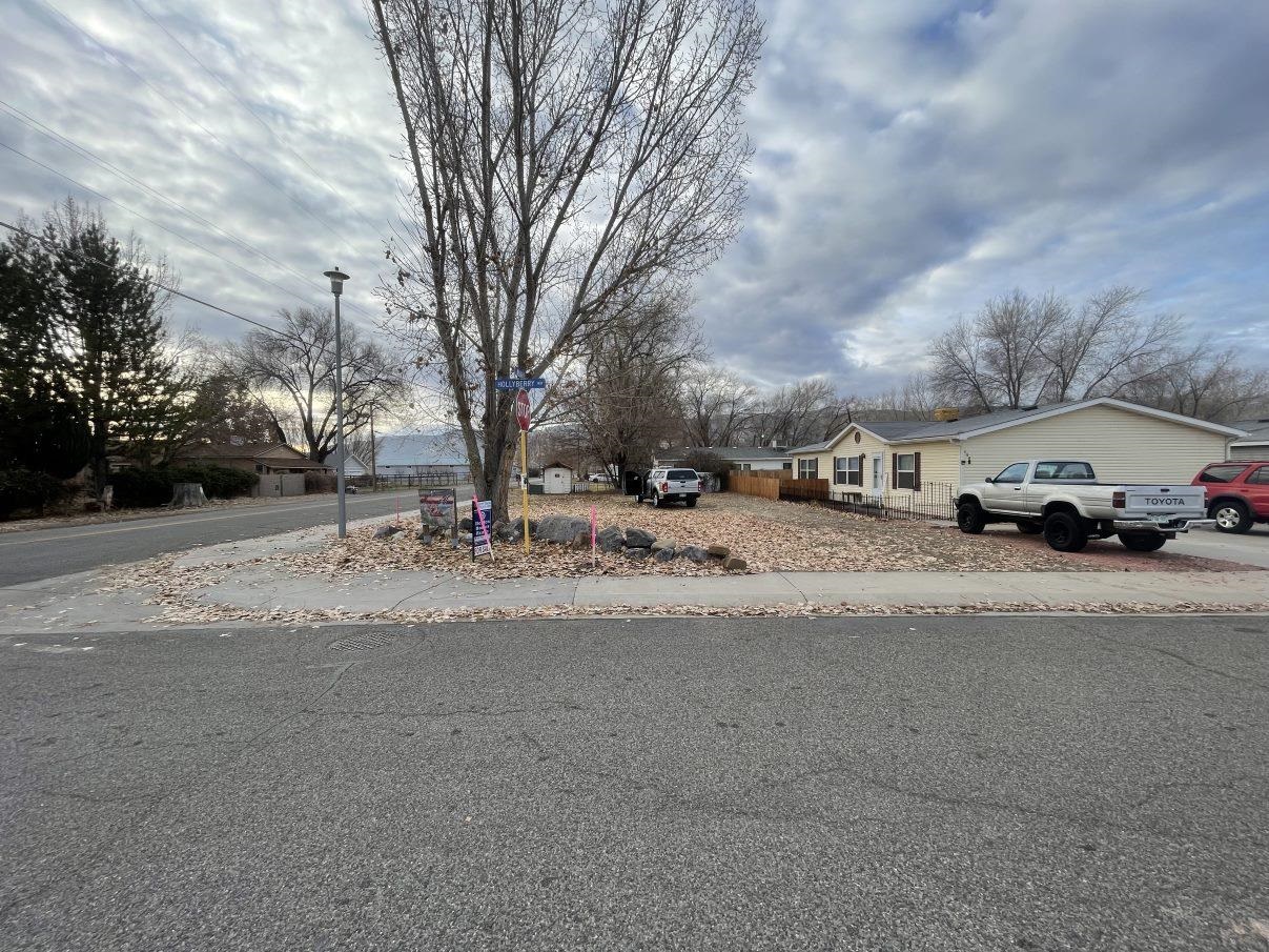 148 Holly Berry Way Fruita, CO 81521 - Photo 16 of 19 a car parked on the side of the road