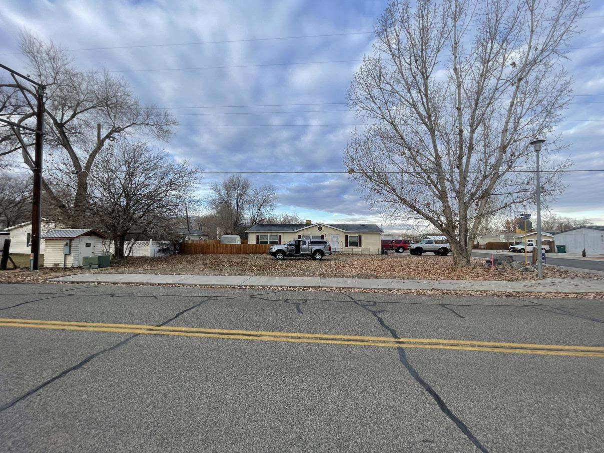 148 Holly Berry Way Fruita, CO 81521 - Photo 17 of 19 a view of a street with houses