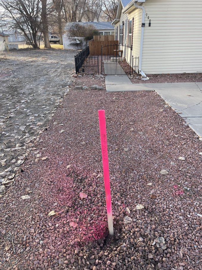 148 Holly Berry Way Fruita, CO 81521 - Photo 18 of 19 a backyard of a house with table and chairs