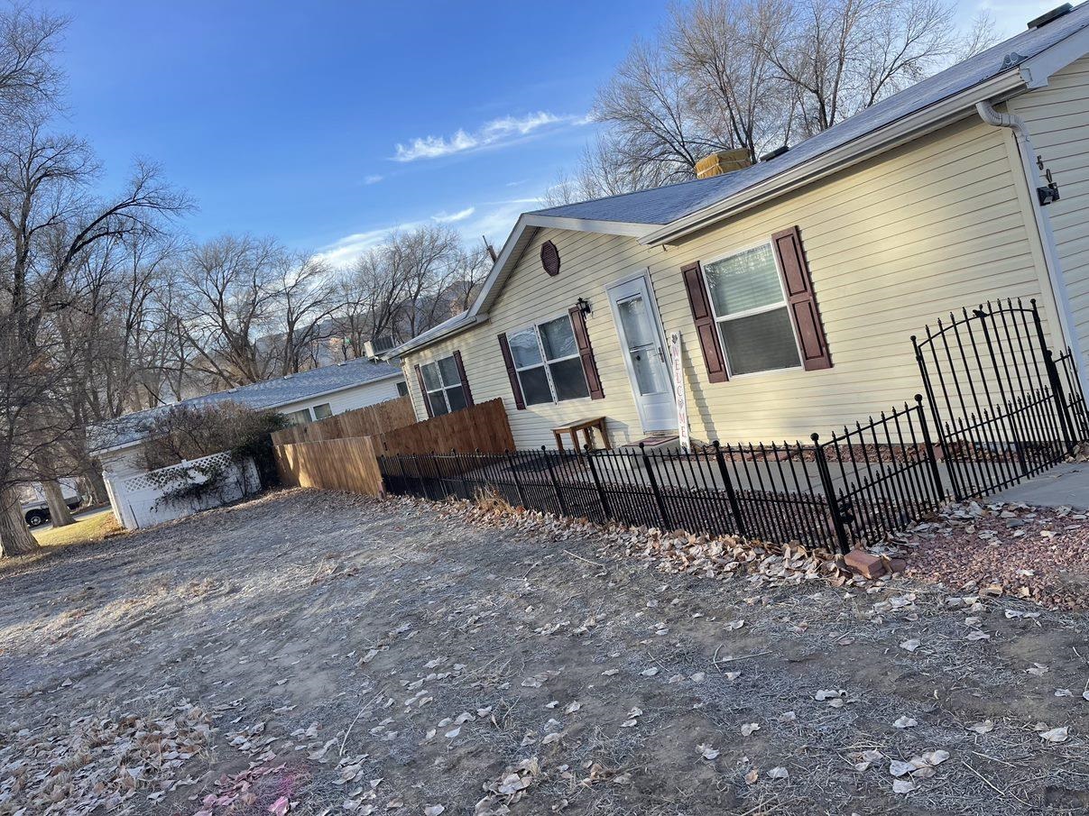 148 Holly Berry Way Fruita, CO 81521 - Photo 19 of 19 a view of a house with a yard