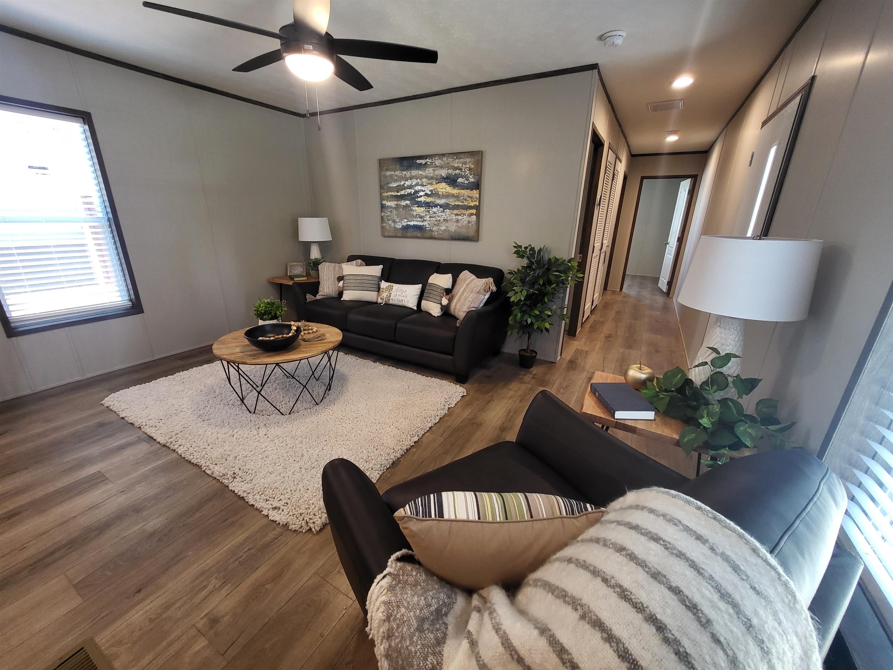 148 Holly Berry Way Fruita, CO 81521 - Photo 4 of 19 a living room with furniture and a wooden floor