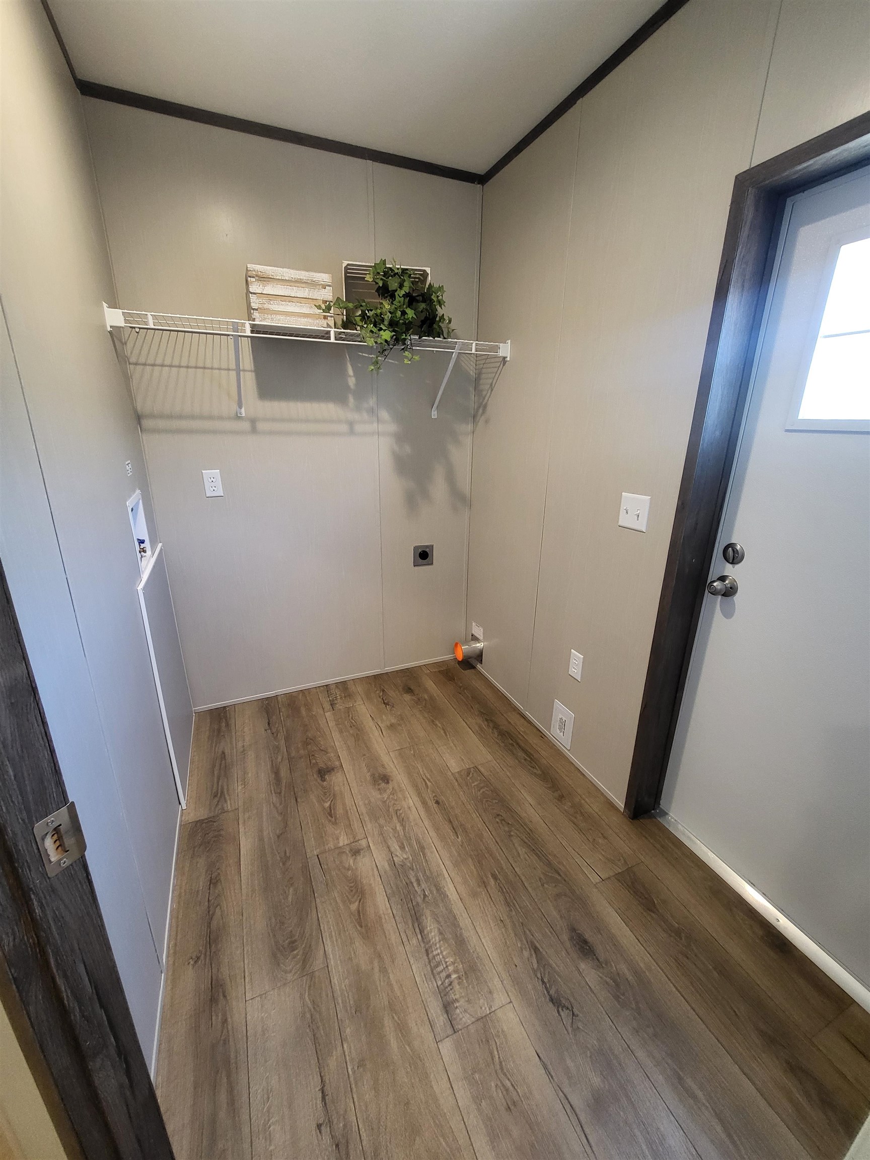 148 Holly Berry Way Fruita, CO 81521 - Photo 10 of 19 view of a room with wooden floor and potted plant