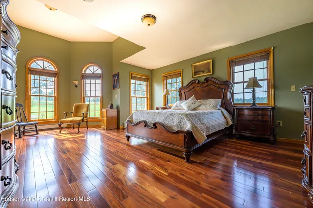 a view of a dining room with furniture and window