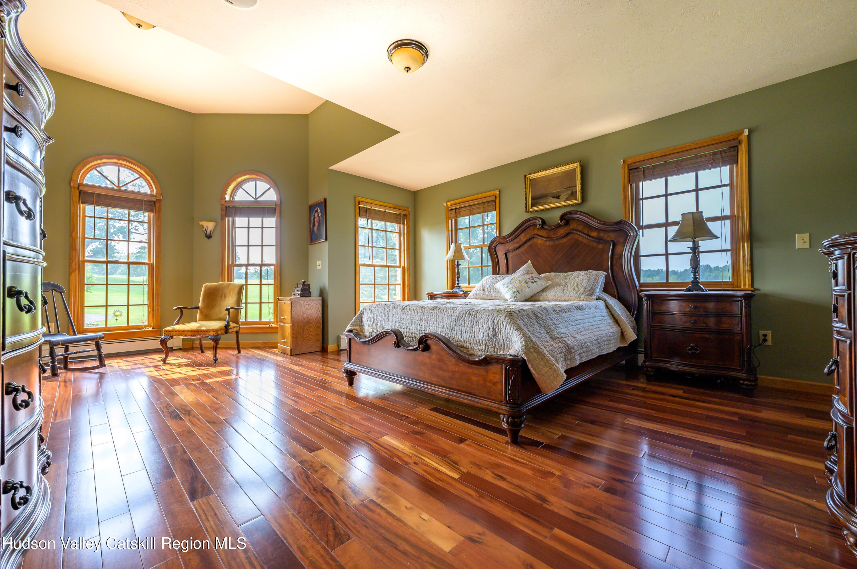 520 Ridge Road Stuyvesant, NY 12156 - Photo 12 of 68 a bedroom with a bed and wooden floor