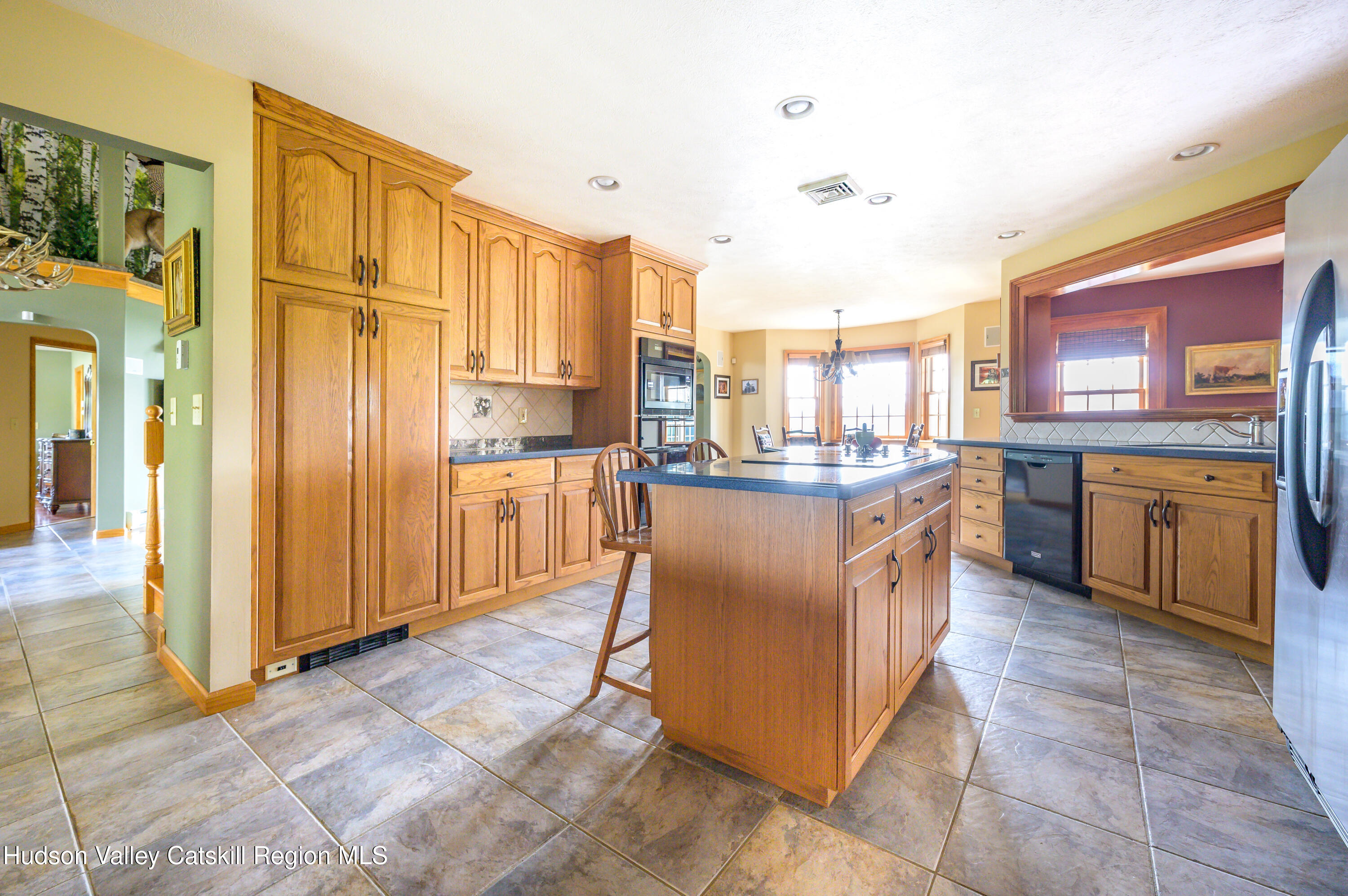 520 Ridge Road Stuyvesant, NY 12156 - Photo 13 of 68 a kitchen with stainless steel appliances granite countertop a stove a sink and a refrigerator