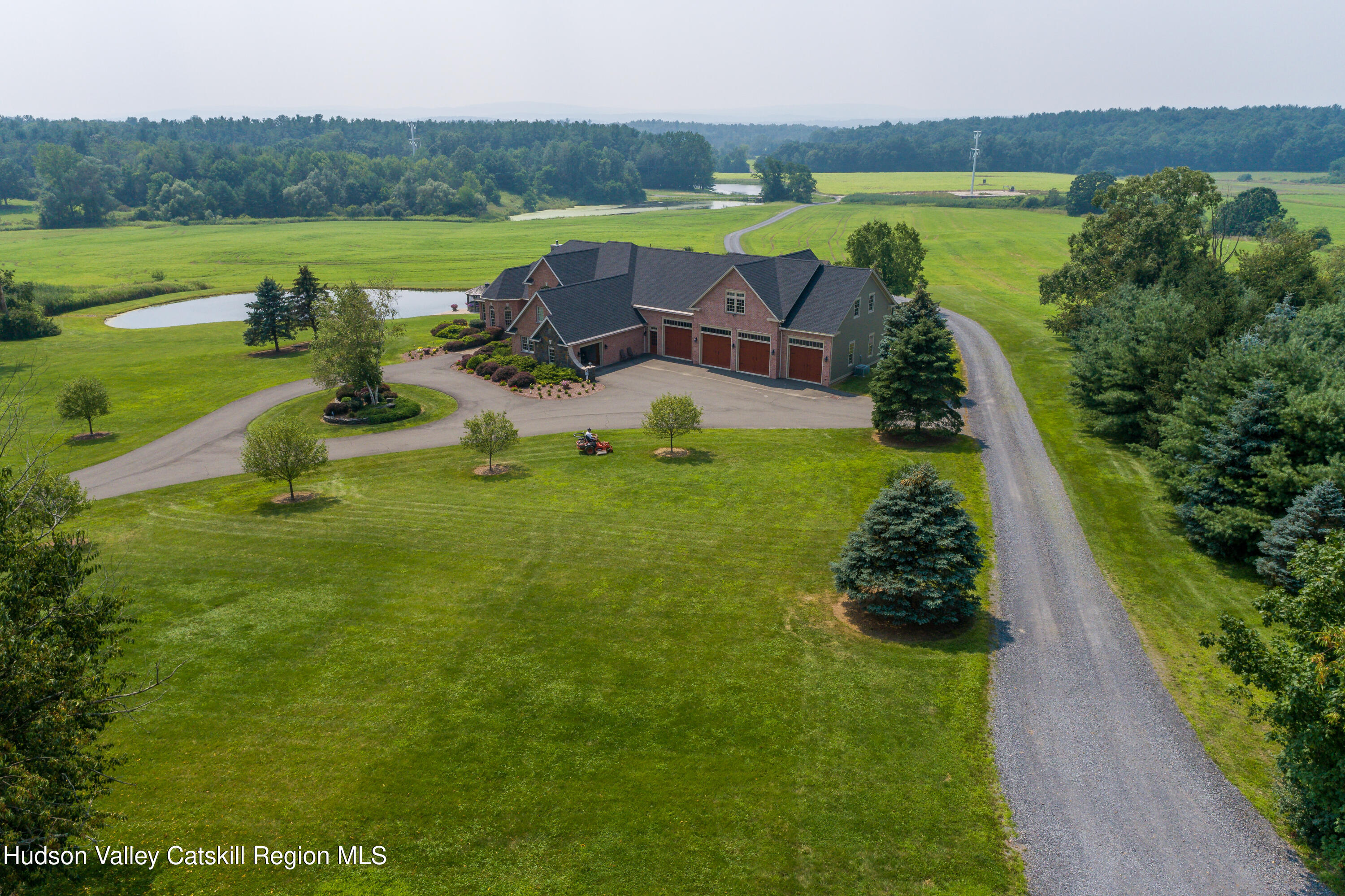 520 Ridge Road Stuyvesant, NY 12156 - Photo 2 of 68 a view of a lake with a yard and mountain view