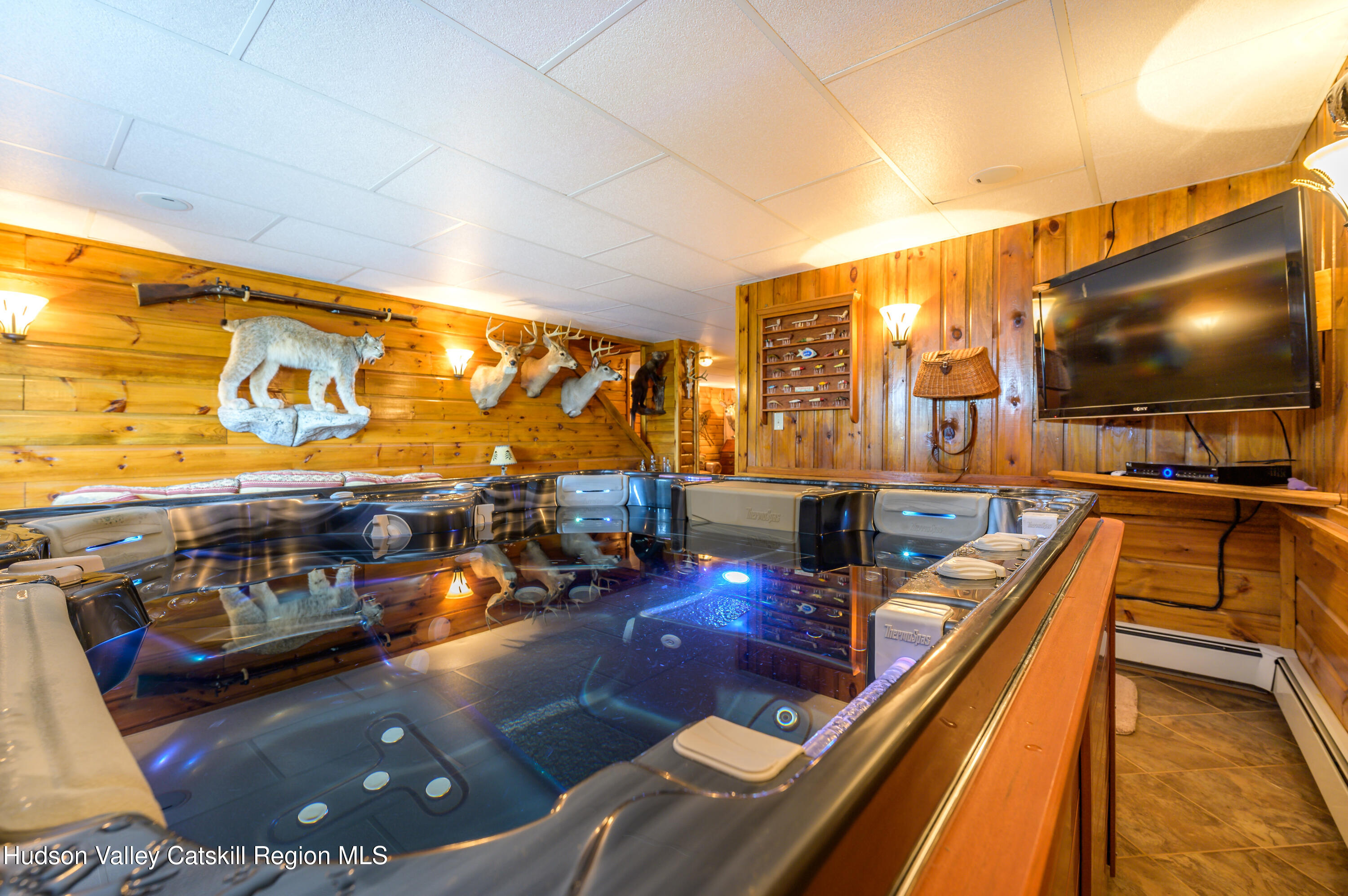 520 Ridge Road Stuyvesant, NY 12156 - Photo 36 of 68 a living room with furniture and a flat screen tv