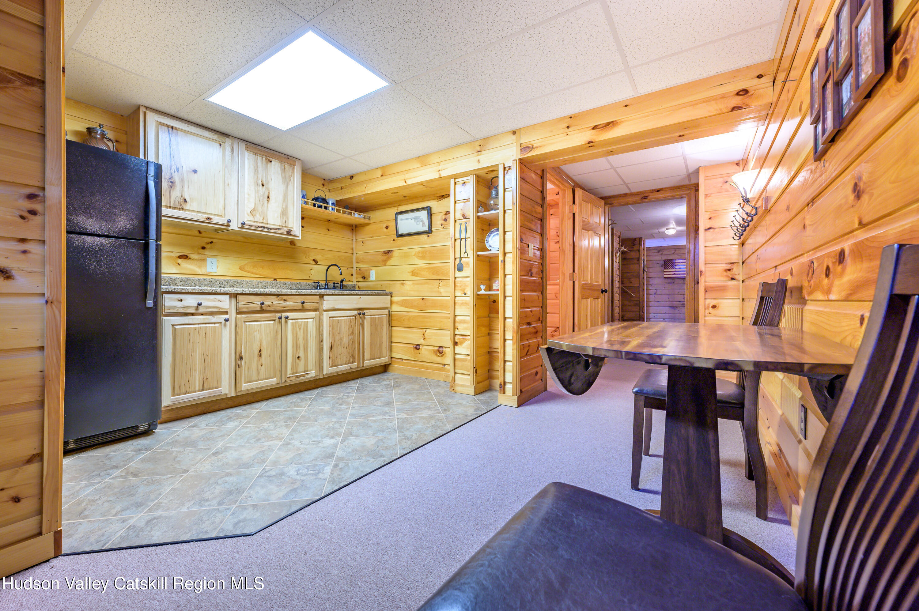 520 Ridge Road Stuyvesant, NY 12156 - Photo 38 of 68 a kitchen with stainless steel appliances kitchen island granite countertop a refrigerator and wooden cabinets