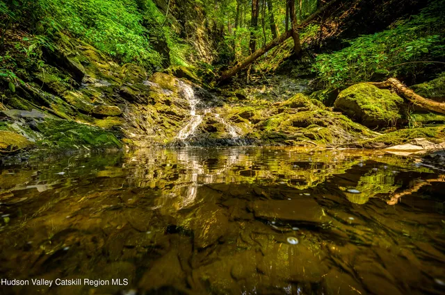 a view of swimming pool with outdoor seating