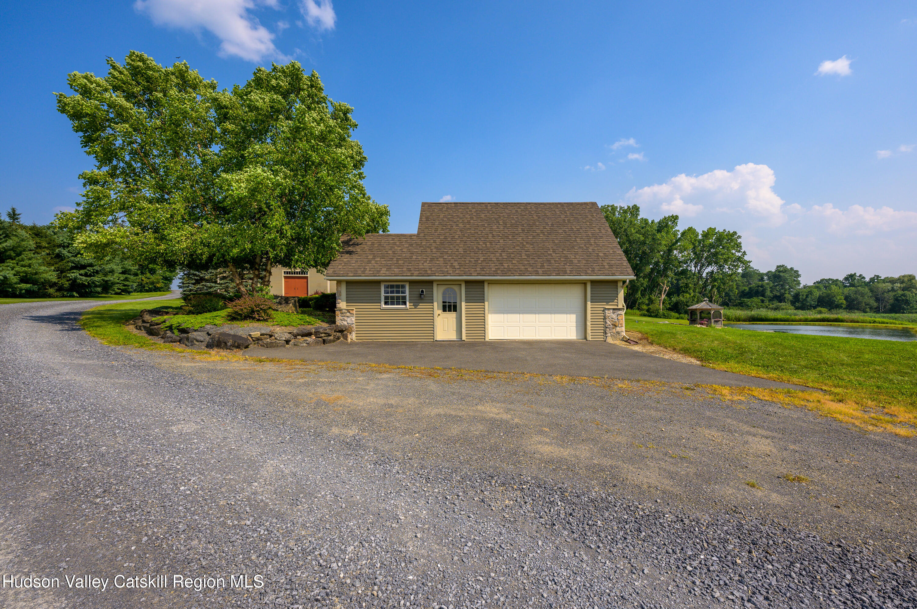 520 Ridge Road Stuyvesant, NY 12156 - Photo 53 of 68 a front view of a house with a yard and garage