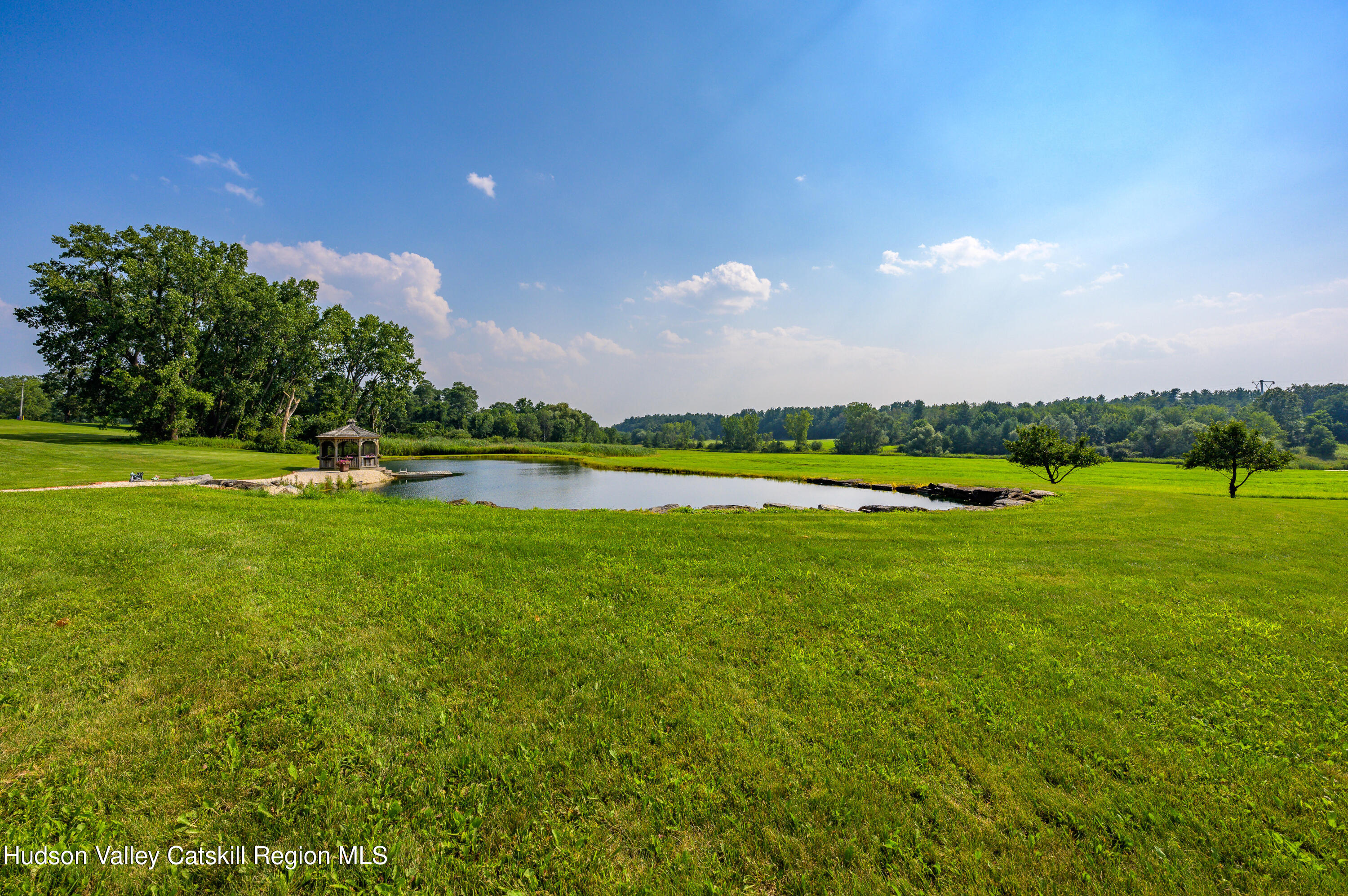 520 Ridge Road Stuyvesant, NY 12156 - Photo 54 of 68 a view of a golf course with a lake