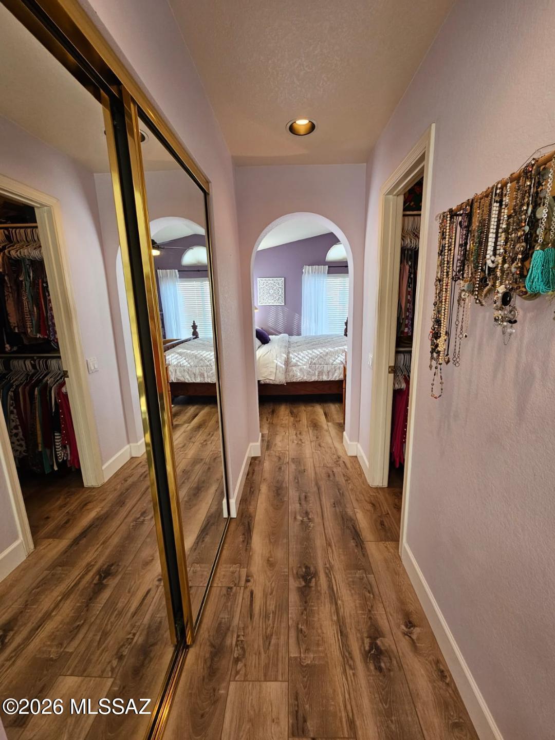 3130 West Star Ranch Trail Tucson, AZ 85742 - Photo 35 of 44 a view of a hallway view with wooden floor and staircase