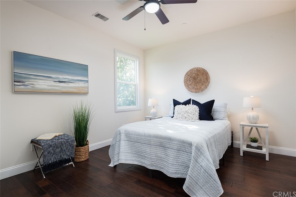 1609 Chestnut Avenue Manhattan Beach, CA 90266 - Photo 13 of 26 a bedroom with bed and a chair with window