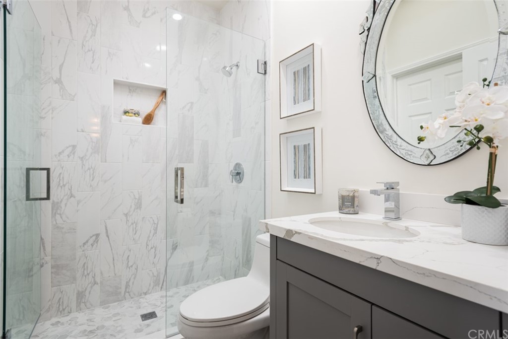 1609 Chestnut Avenue Manhattan Beach, CA 90266 - Photo 15 of 26 a bathroom with a sink a toilet and shower