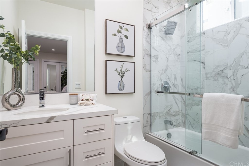 1609 Chestnut Avenue Manhattan Beach, CA 90266 - Photo 18 of 26 a bathroom with a sink a toilet and shower