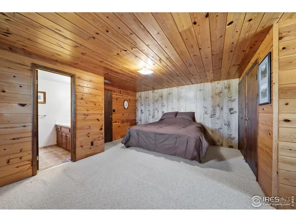 a bedroom with a bed and dresser