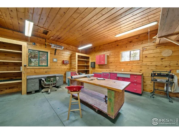a room with pool table table and sofas