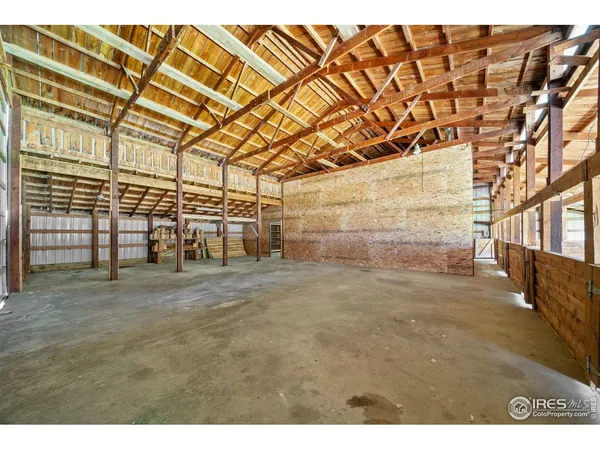 a view of an empty room with wooden walls