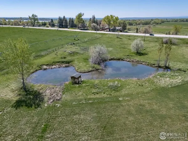 a view of a lake in between two of the houses