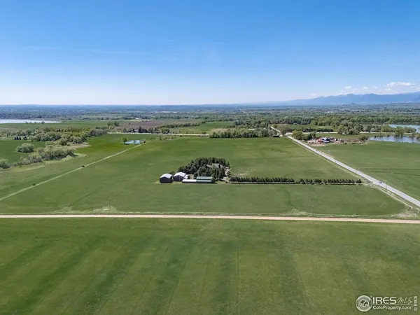 a view of a golf course with a ocean view