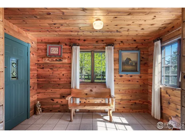 a view of a hallway with seating area