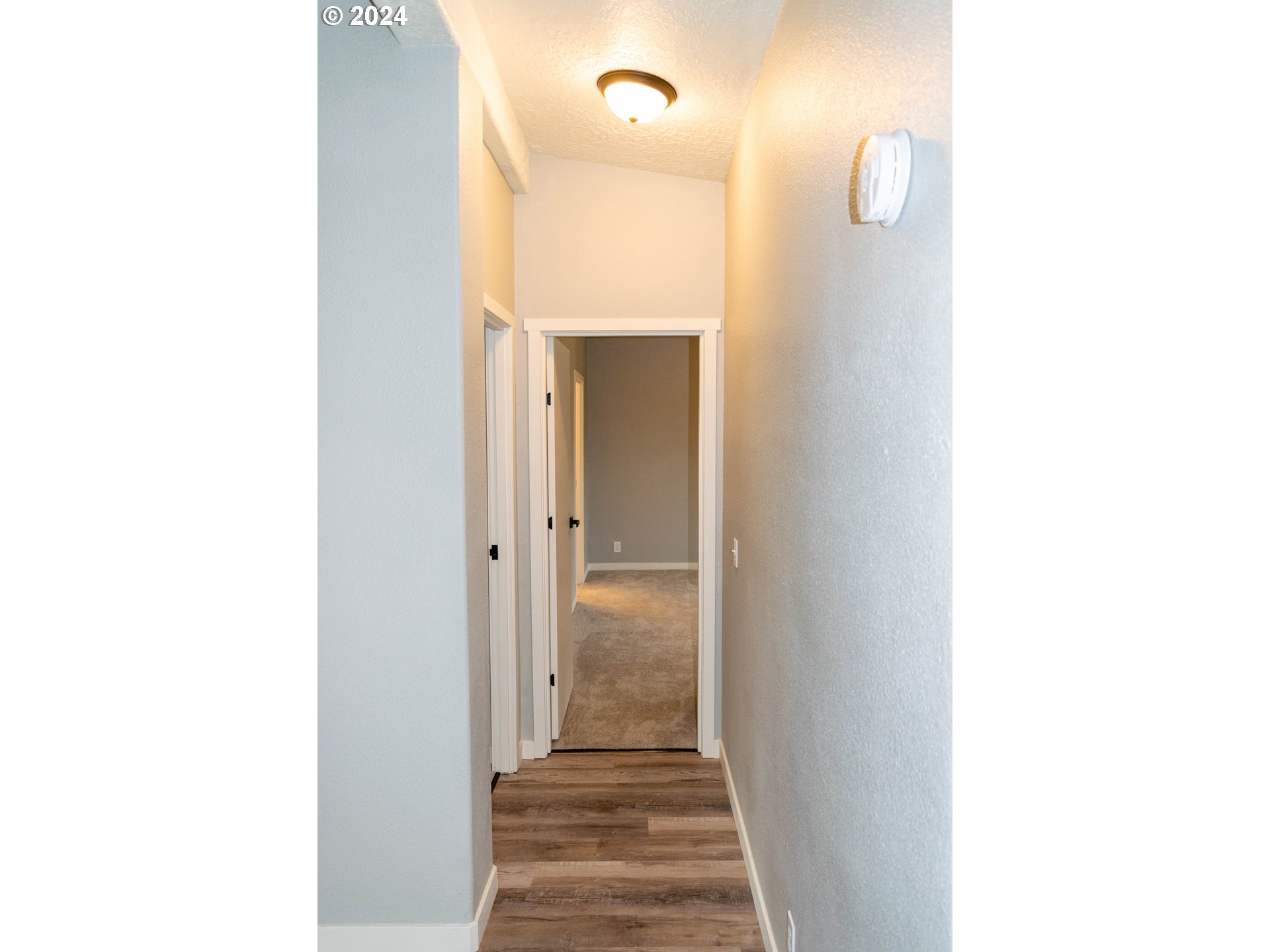 28157 Cottage Grove Lorane Road Cottage Grove, OR 97424 - Photo 11 of 33 a view of a hallway with wooden floor